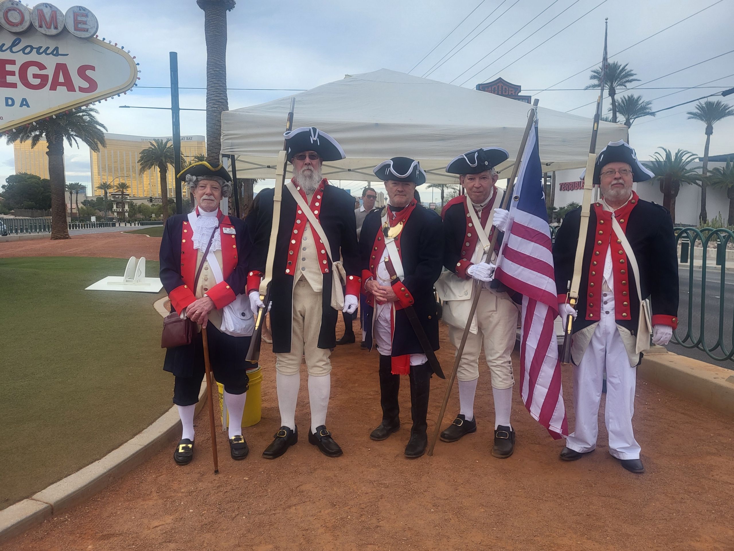 Signers Chapter Color Guard at the Welcome to Fabulous Las Vegas sign.
